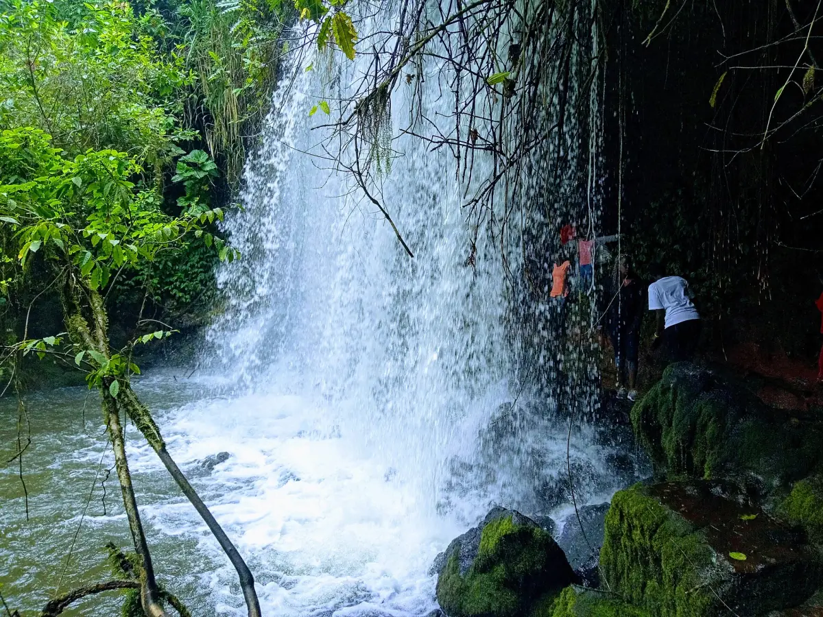 Waterfall dropping beside the Amabere ga Nyinamwiru caves near Fort Portal