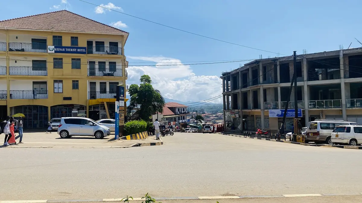 Busy junction with shops and minibuses in the centre of Fort Portal